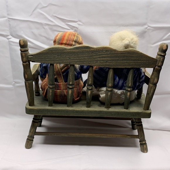 Grandma and grandpa sitting on a wooden bench - Picture 6 of 6